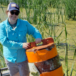 volunteer sectioning off a lake in michigan